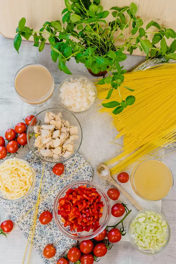 Table Flatlay Set With Chicken Spagetti Ingredients