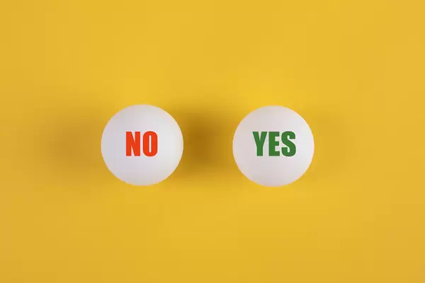 Table tennis balls with Yes and No text