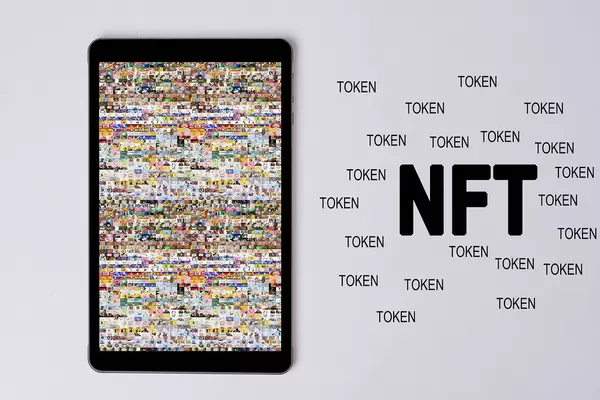 Tablet screen with a NFT art collage made of thousands of photos