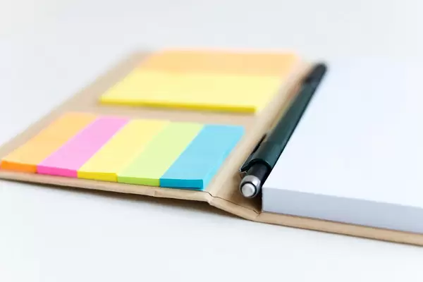 Take some notes: Notebook with a pen and stickers