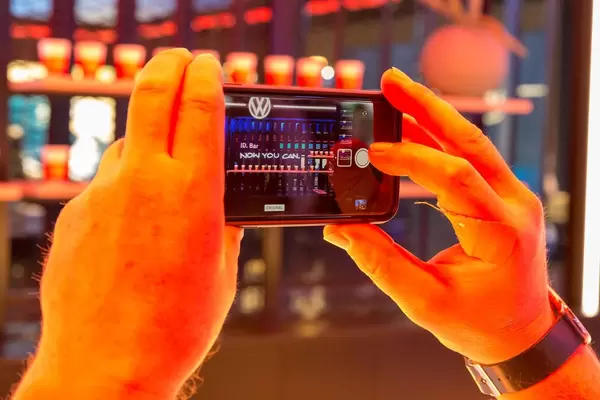 Taking instagram pictures at the car show IAA: Photo of VW Bar and ID.3 ad slogan "Now you can"