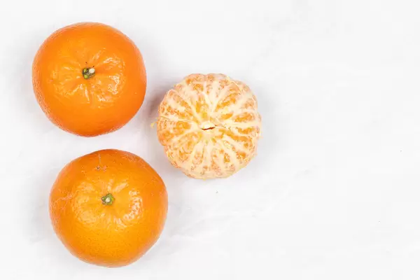 Tangerines on the grey marble table with copy space