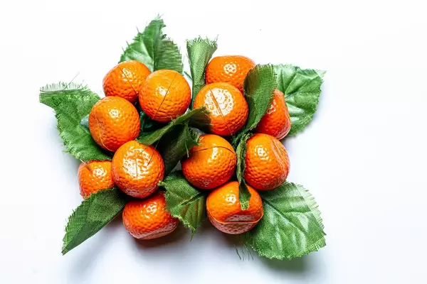 Tangerines with leaves fridge magnets on a white background (Flip 2020)