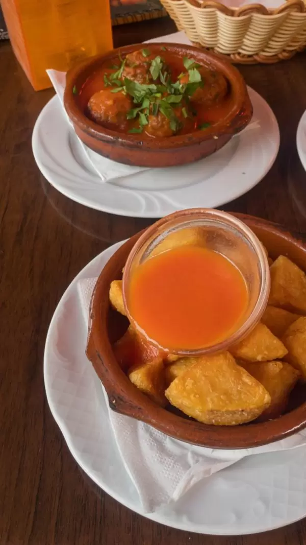 Tapas: deep-fried potatoes and meat balls