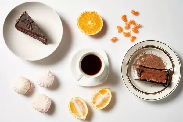 Tasty chocolate cakes, homemade zephyr sweets and a cup of coffee