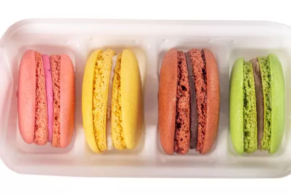 Tasty colorful macaroons in white box
