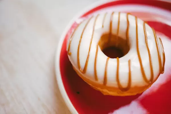 Tasty donut with caramel decoration