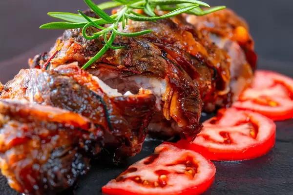 Tasty slices baked meatloaf on table