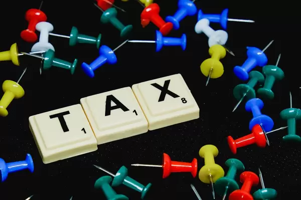 Tax text on black background