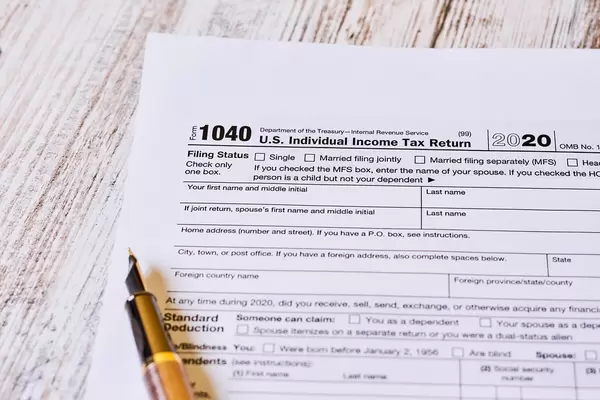 Tax time - Close-up shot of U.S. 1040 tax return form with pen