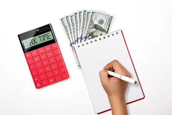 Tax time concept with calculator and us dollars