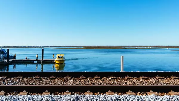 Taxi boat in froant of railwasy track
