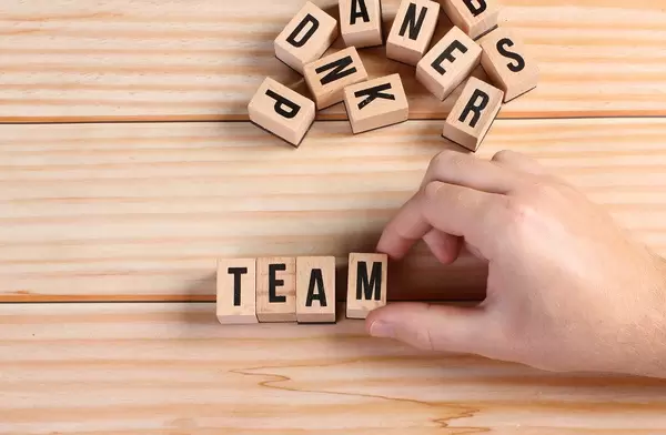Team word written on wooden blocks