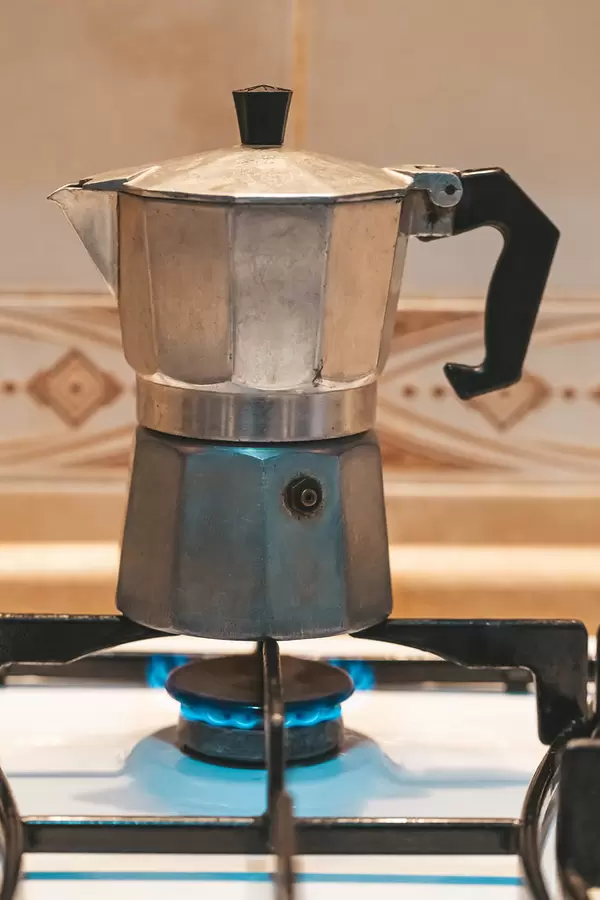 Teapot with coffee on the stove
