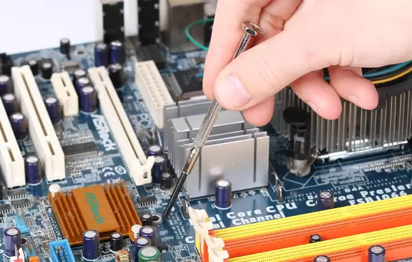 Technician repairing broken computer