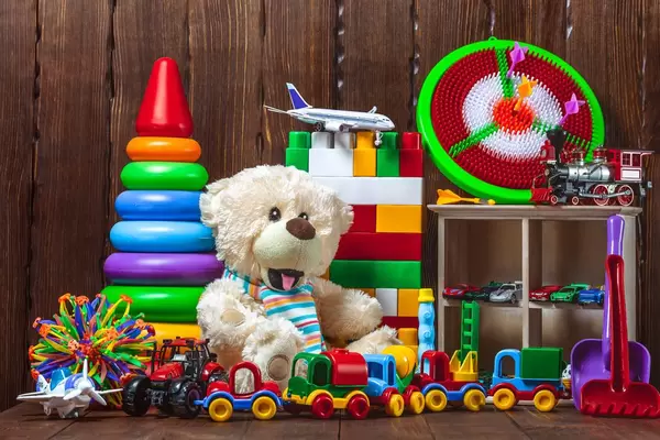 Teddybear with colourful kids toys
