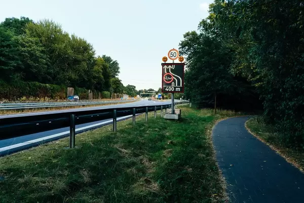 Temporary speed and width restriction road sign