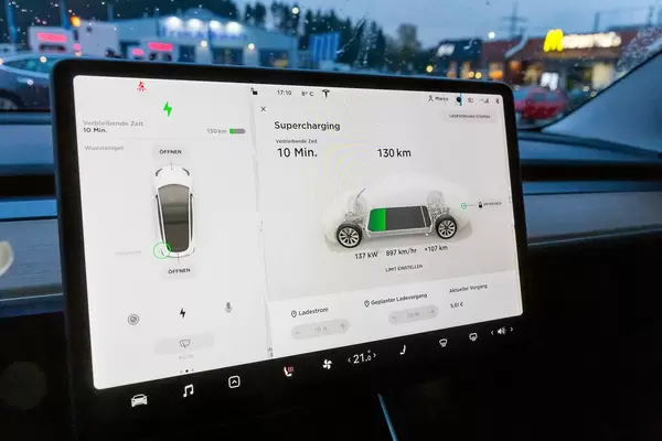 Tesla Supercharging board computer in the car during the charging phase
