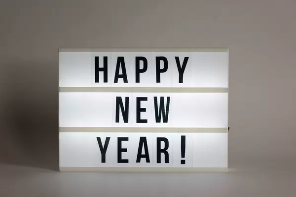 Text on luminous panel wishes a happy new year!