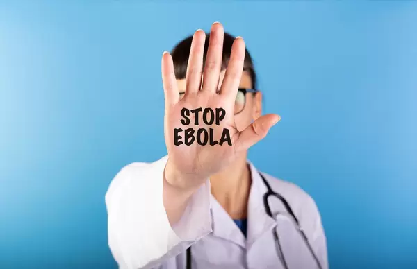 Text Stop Ebola in the palm of doctors hand