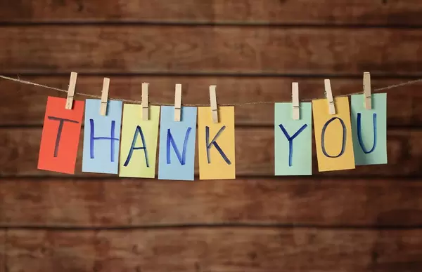 Thank you cards hanging on a rope with clothes peg