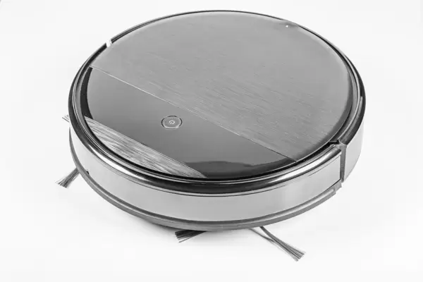 The automated robot vacuum cleaner of a roundish form on white