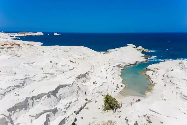 The beautiful white cliffs and turquoise sea of Milos, Greece with very few tourists in summer 2020