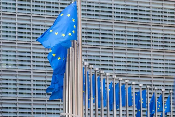 The Berlaymont Building in Brussels with flags of the European Union giving place to the European Committee