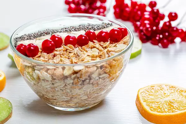 The concept of a healthy Breakfast - oatmeal with fruit and Chia seeds