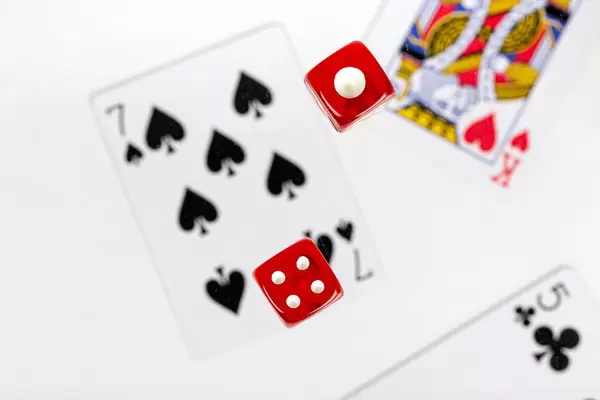 The concept of gambling and luck. Dice and cards