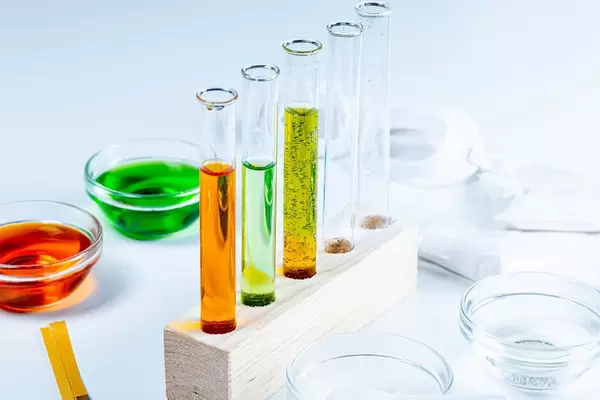 The concept of studying chemistry. Test tubes and reagents on a white background