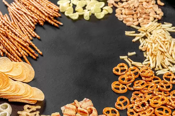 The concept of the Oktoberfest. Frame with beer snacks on black background (Flip 2019)