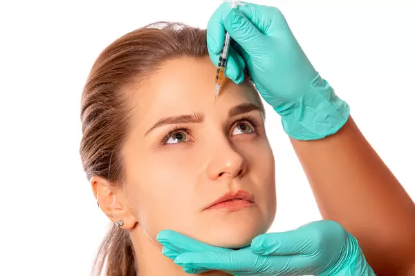 The doctor cosmetologist makes the rejuvenating facial injections