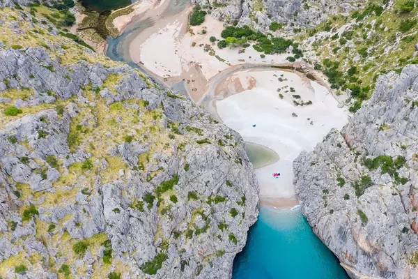 The estuary of the Torrent de Pareis forming the stunning bay of Sa Calobra in Mallorca. Aerial view