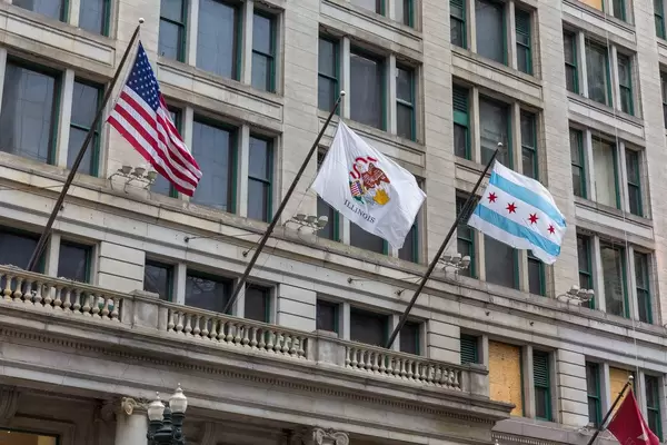 The flags of the US, of the State of Illinois and of the City of Chicago blowing in the "Windy city"