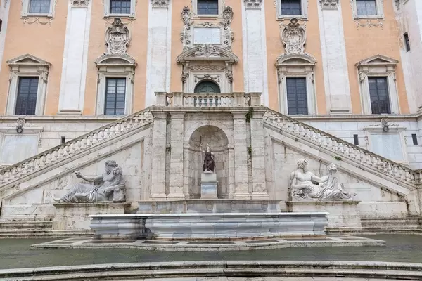 The impressive fountain with statues at the entrance of the Capitoline Museums