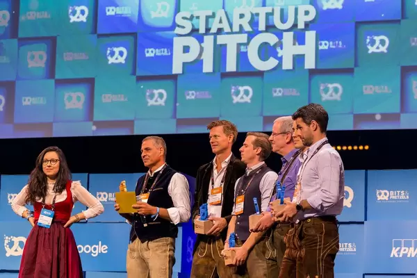 The jury of investors in traditional Oktoberfest costumes prepares to announce the name of the winner after the startup pitch at Bits & Pretzels 2019