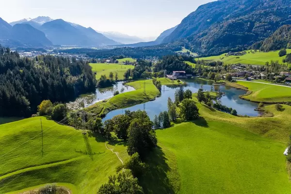 The many lakes surrounding the village of Kramsach in the Brandenberg Alps in Austria. Drone photo