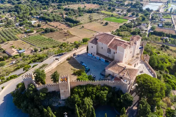 The medieval fortress and sanctuary of Sant Salvador on the Calvary Hill in Artà in a drone photo