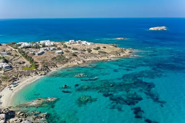The Mikri Vigla headland with its two north- and south-facing beaches. Drone shot on Naxos, Greece