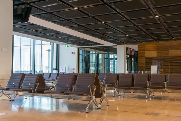 The new airport BER in Berlin: waiting area with seating at a gate without passengers