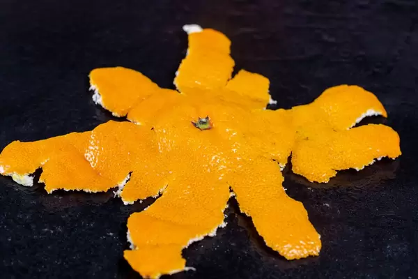 The peel of ripe tangerines on a black background