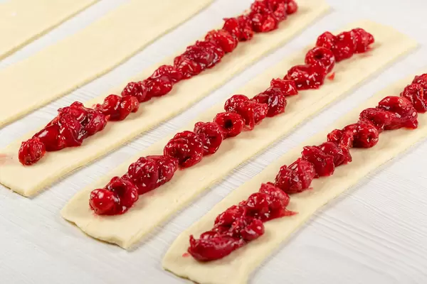 The process of making bun sticks with cherries