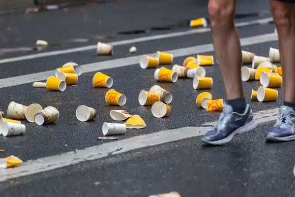 The result of fast nutrition during endurance events - empty cups at the ground to clean up