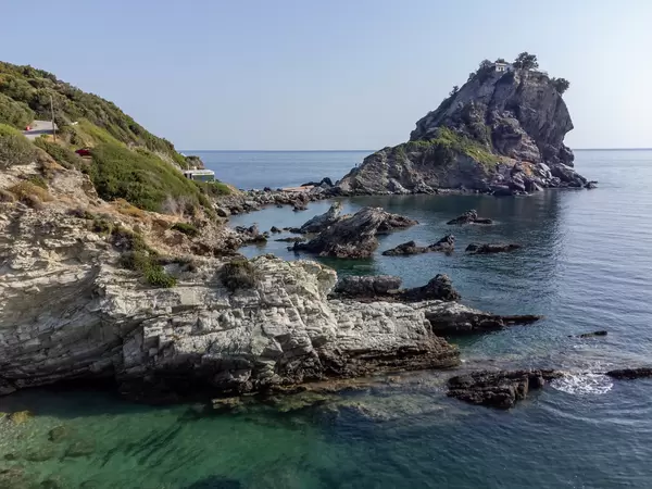 The rocky coast at Agios Ioannis, Skopelos, with the monastery and chapel accessible with 200 steep steps