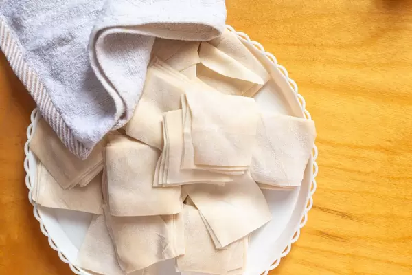 The stack of dough cut into a rectangle shape. Dough for cooking dumplings