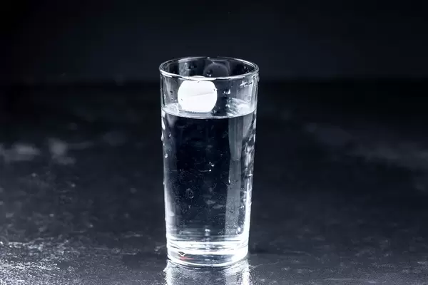 The tablet is lowered into the water