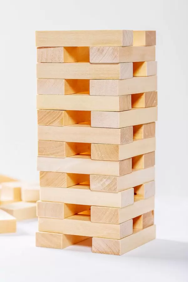 The tower is built with wooden parts of the game Jenga