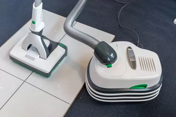 The vacuum squeegee Kobold VT300 & SP600 cleans dog hair on tiles and is presented at the pet fair 2019 in Cologne, Germany