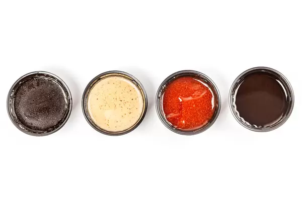 The various barbecue sauces in bowls, top view